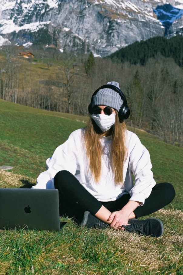 woman wearing face mask on mountain